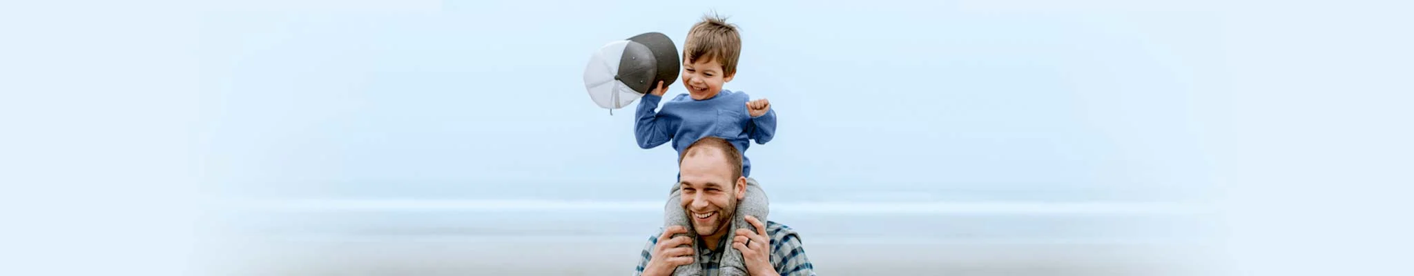 Father carrying his child on his shoulders